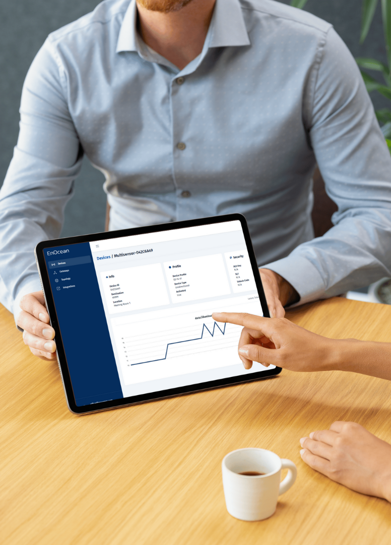 A guy shows a tabled with smartstudio on it
